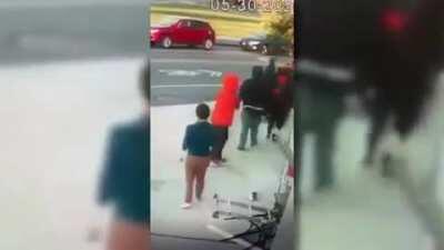 Looters attacking an elderly woman trying to defend her business