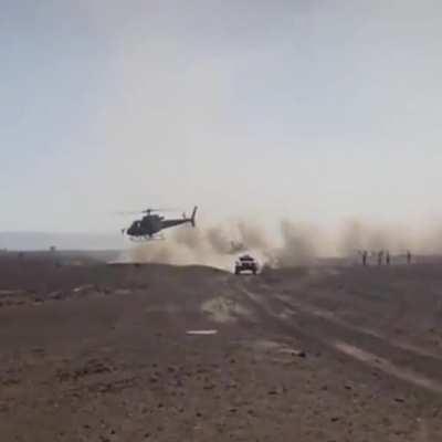 This helicopter pilot keeping pace with a Dakar rally truck