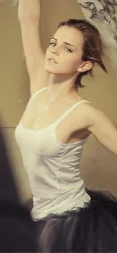 Emma Watson braless in a white tank top