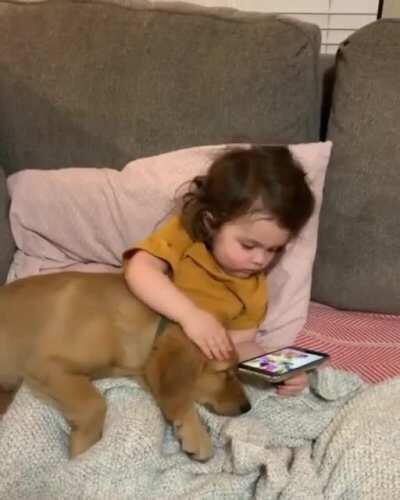 Girl cuddling with her little brother before nap time