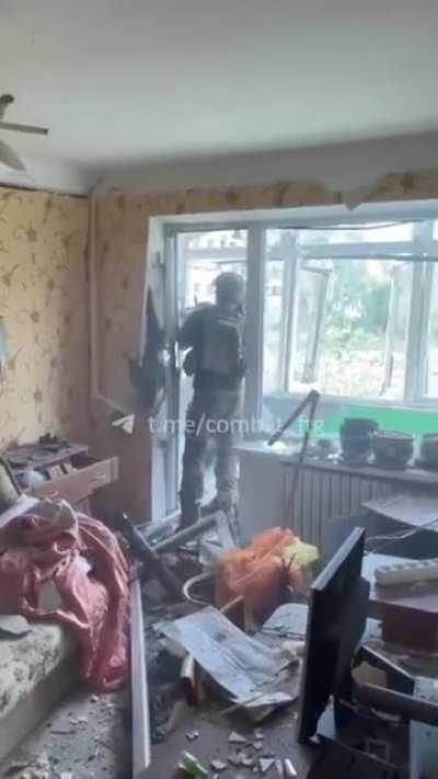 A soldier from the 95th Air Assault Brigade firing a disposable anti tank weapon form inside of building in the Donetsk region