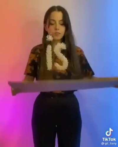 Girl using rice to show lyrics