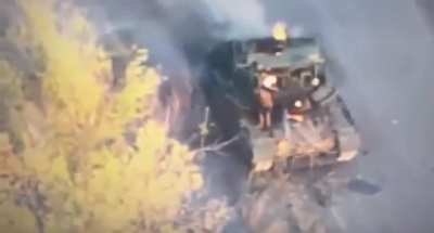 Russian Tank Cooks Off And Crewman Hit By Kamikaze Drone.