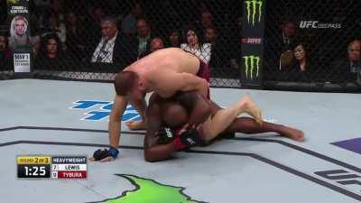 Derrick Lewis gets controlled and out grappled by Marcin Tybura, but then Derrick knocks him out anyway.