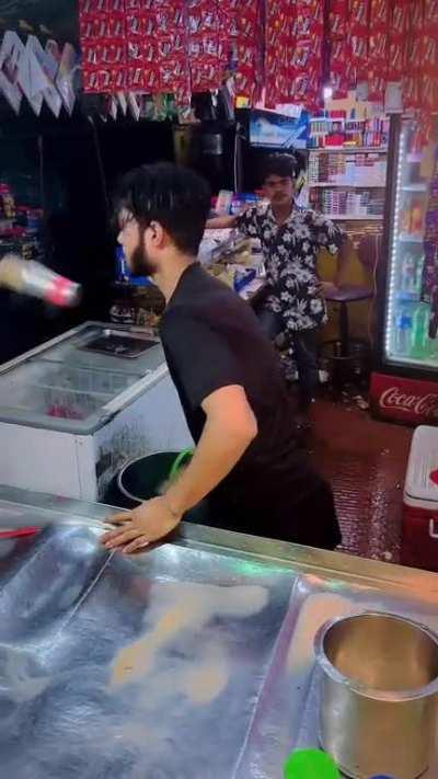 The skills of this guy for making a milk shake 