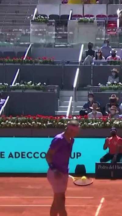 Rafael Nadal catches opponent's shot with his racket