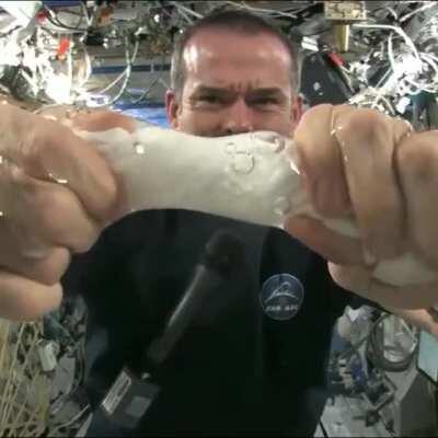 This is what happens when you wring out a wet towel while floating in space.