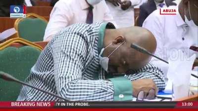 A Nigerian official fake fainted after he was grilled about missing funds.