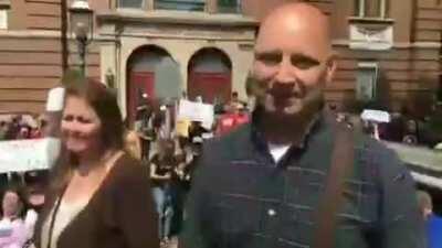 PA State Senator Doug Mastriano points and laughs at protestor starting 