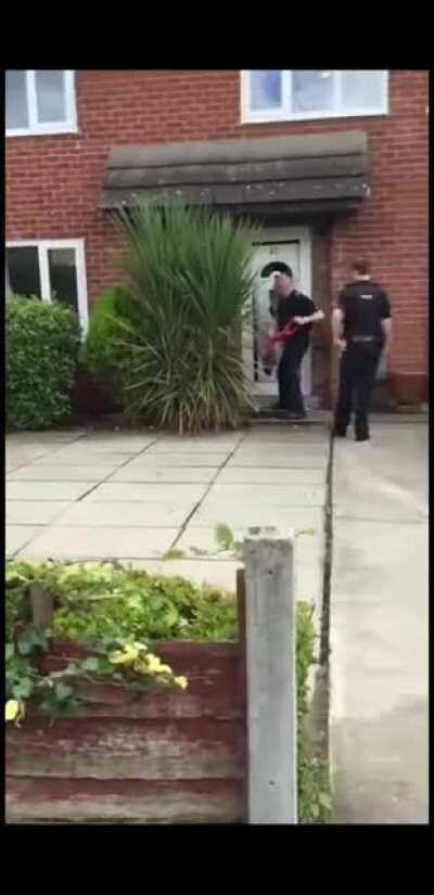 Police forcing entry to a home...