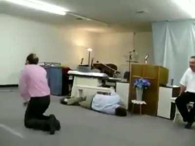 Televangelist con man pretends to be possessed by the holy spirit