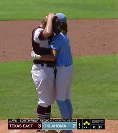 This is how you know you raised your child correctly. A Little League Baseball player hugs the shaken up pitcher who nailed him in the head. True Sportsmanship!