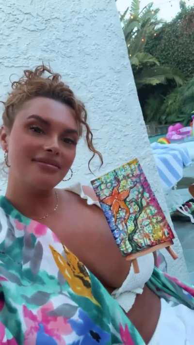 Joy showing off her painting | IG 8/4/24