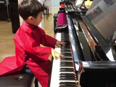 Little genius pianist.