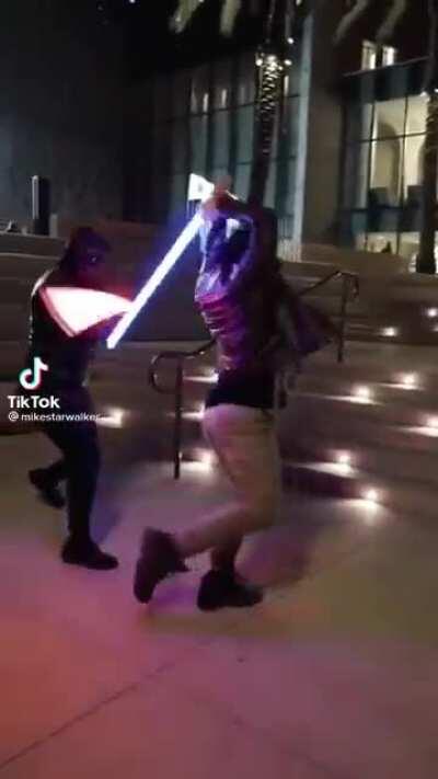 Very epic lightsaber duel irl