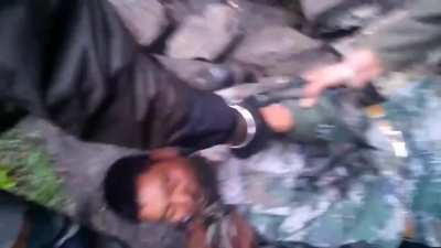 Indian soldiers stop , beat and apprehend 2 Chinese scouts in the Eastern border , they appear to be snatching a camera from the Chinese soldier.