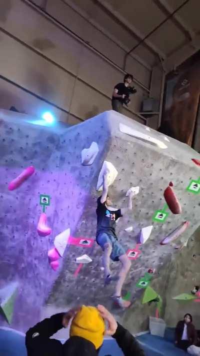 Rock climber wins a competition with an insane walk off bathang sequence, crowd goes wild.