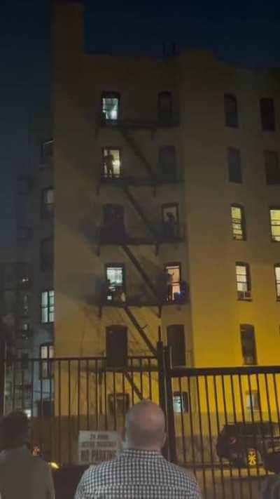 Neighbors jamming out perfectly together by fire escape. Full body chills.