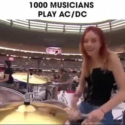 1,000 musicians coordinate to play AC/DC