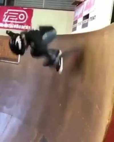 13 year old boy does a fakie 720 bigspin