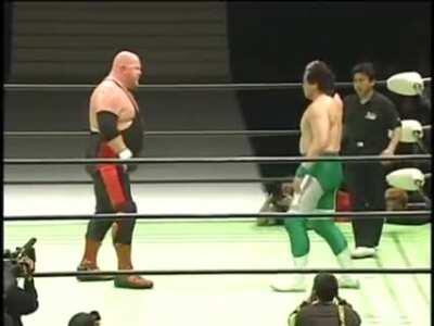 Misawa doesn't take kindly to Vader spitting at him