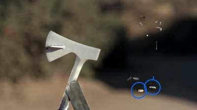 A bullet hitting an axe and being split into eight pieces