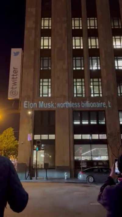 A new projection insulting Elon Musk displayed outside of Twitter’s HQ.