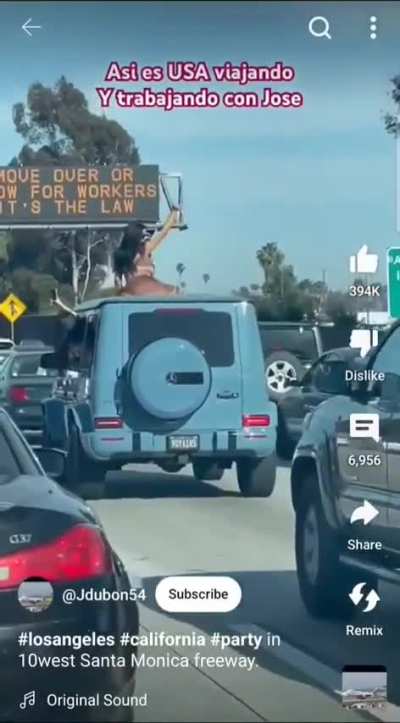 Twerking on top of a car in traffic