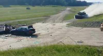 Tank at full speed drives over a Car.