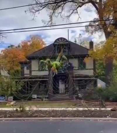 A Buffalo resident made a Halloween decoration for his home. A huge spider crawls from the roof onto the lawn. Arachnophobes will love it, especially in the dark.