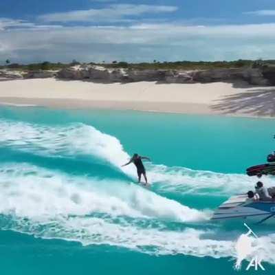 A surfer with a smooth, satisfying method for getting on a boat