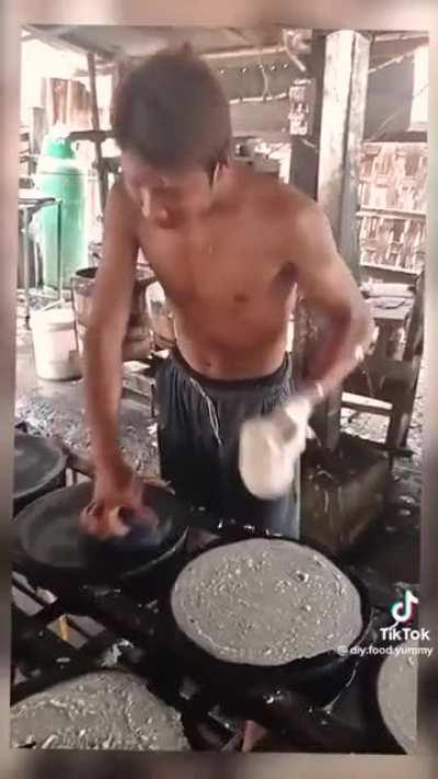 This man making tortillas by hand