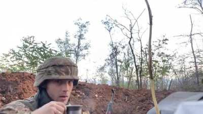 Ukrainian soldier drinking coffee while in a gunfight somewhere between Lyman and Bakhmut