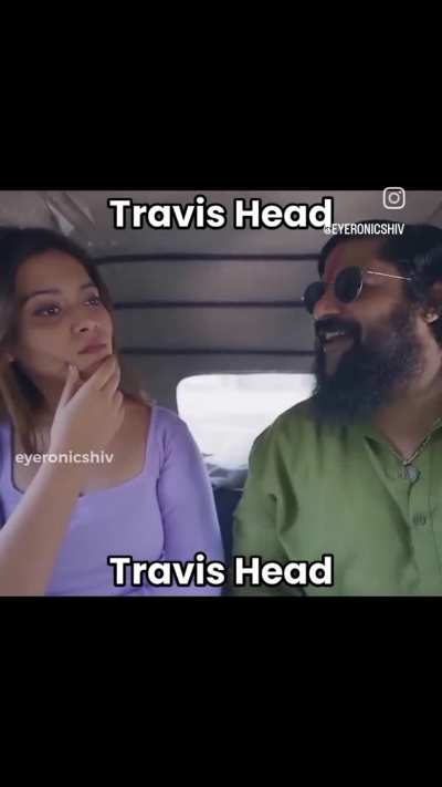 Travis head against blue