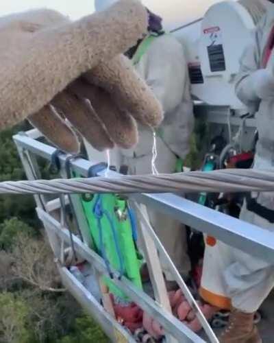 This is what it looks like when grabbing onto 138,000 volts of power line cables