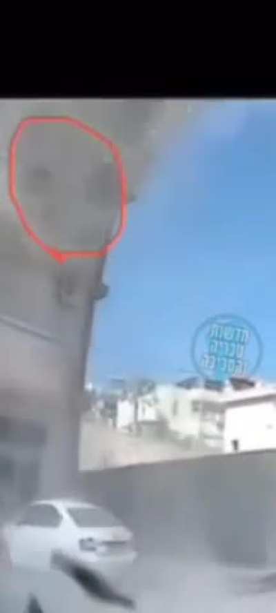 People film interceptions from their balcony, rocket/sharpnel hits their building. Northern Israel, October 2024.