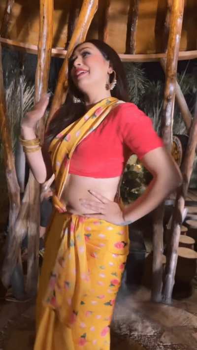 Sapna Chauhan in yellow saree