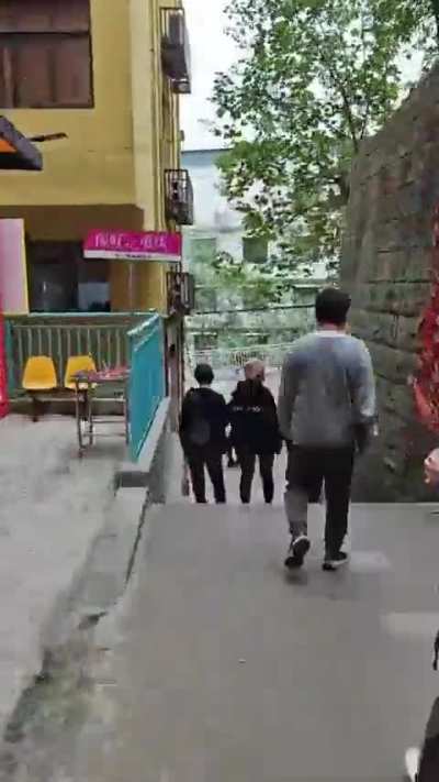 This gentleman in Chongqing, China shows how far down he must go to get to his office 