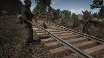 In Red Dead Redemption 2, NPC's working on the railroad actually nail the track into the ground, before moving onto the next nail.