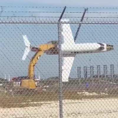 Man in Florida flies plane with an excavator