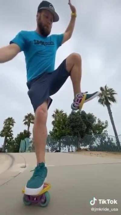 Man roller skates with skates that aren't attached to his feet