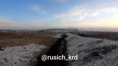 GoPro footage showing two Russian soldiers in the Bilohorivka area, they advance through a shallow trench until they have to retreat into a dugout where they hold out, Spring 2024 (no music)