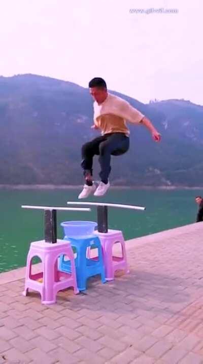 Man Does a Double Jump by &quot;Skipping&quot; His Shoes Over a Bowl of Water