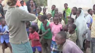 African children hearing fiddle music for the first time.