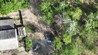 Ukrainian drone dropping munitions on Russian soldiers