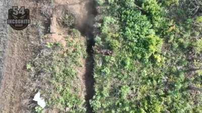 A Ukrainian drone near Kharkiv takes out a Russian soldier trying to hide in a trench with a grenade 5-20-24