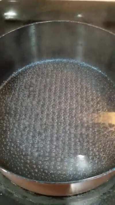 The bubbles line up when I boil water because of the diamond pattern on the bottom of my pot