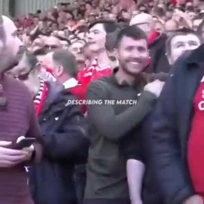 A guy explaining the match to his blind friend