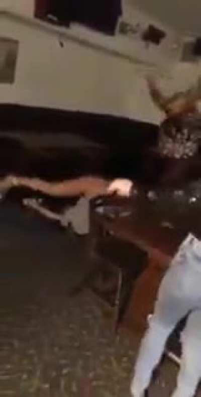 Drunk girl does backflip on a table