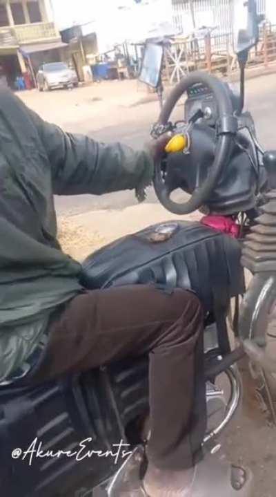 This guy modified his motorbike to have accelerator foot pedal, hand-gear and a steering wheel